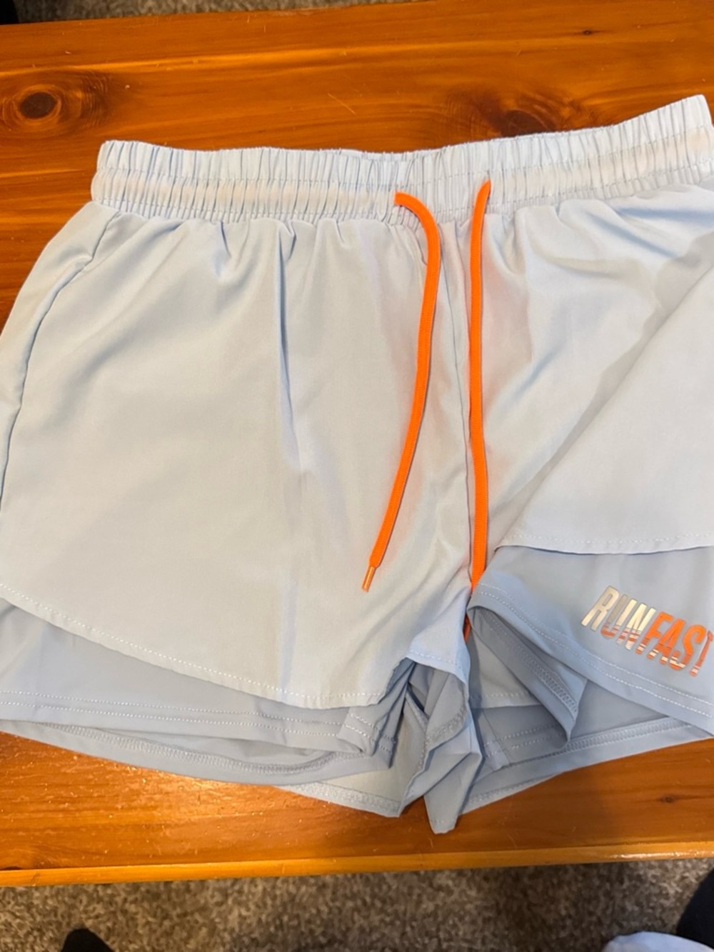 Light Blue Women’s Athletic Shorts with Orange Drawstring
